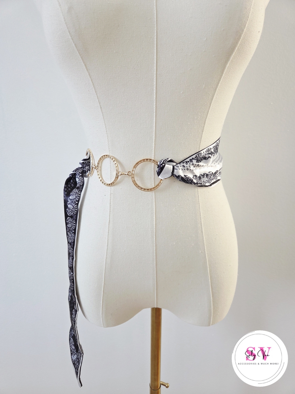Black and white paisley print belt with gold accents